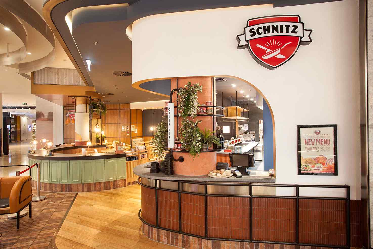 Schnitz Chadstone fitout by Shape shopfitters with curved commercial joinery and architectural metalwork