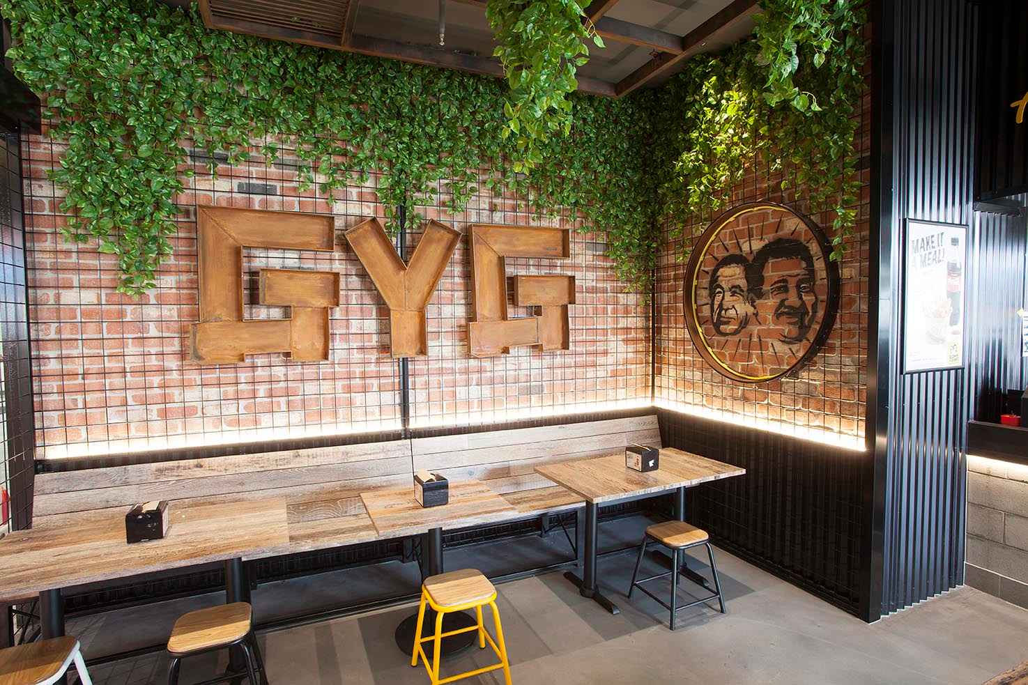 Guzman Y Gomez Boxhill Signage in Architectural Metalwork design on wall with bush background