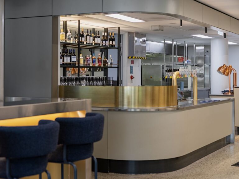 Hospitality bar fitout by Shape Shopfitters featuring custom joinery, brass bar detailing and shelving at St Andrews Beach Brewery Melbourne